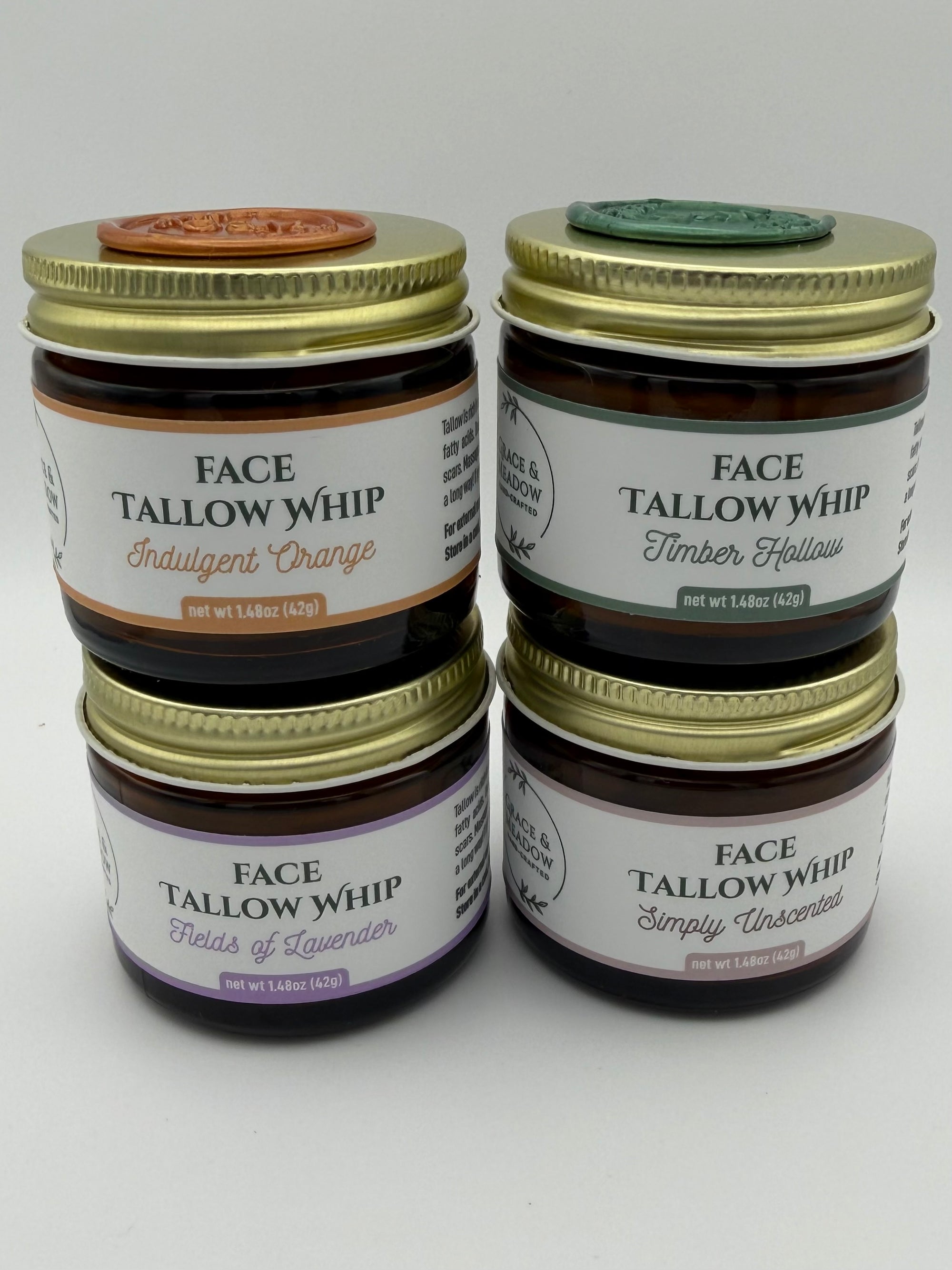 Four jars of Face Tallow Whip Jars with on a white background